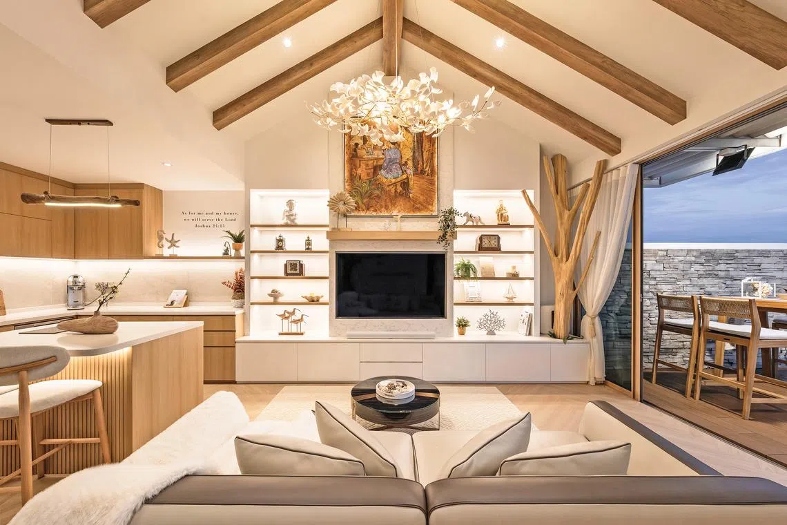 The open-plan living room on the second level is adjacent to the dry kitchen and patio.