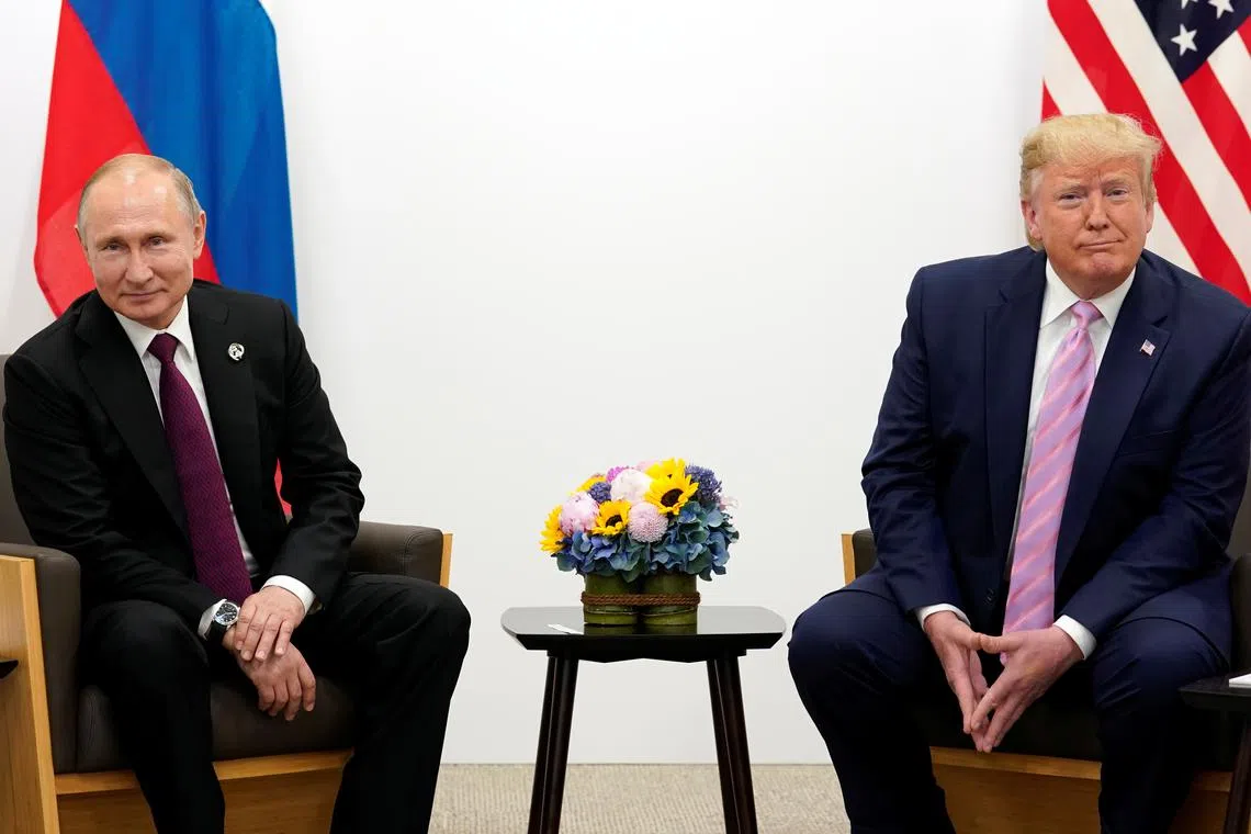 FILE PHOTO: U.S. President Donald Trump meets with Russian President Vladimir Putin at the G20 Summit in Osaka, Japan June 28, 2019.  REUTERS/Kevin Lamarque/File Photo