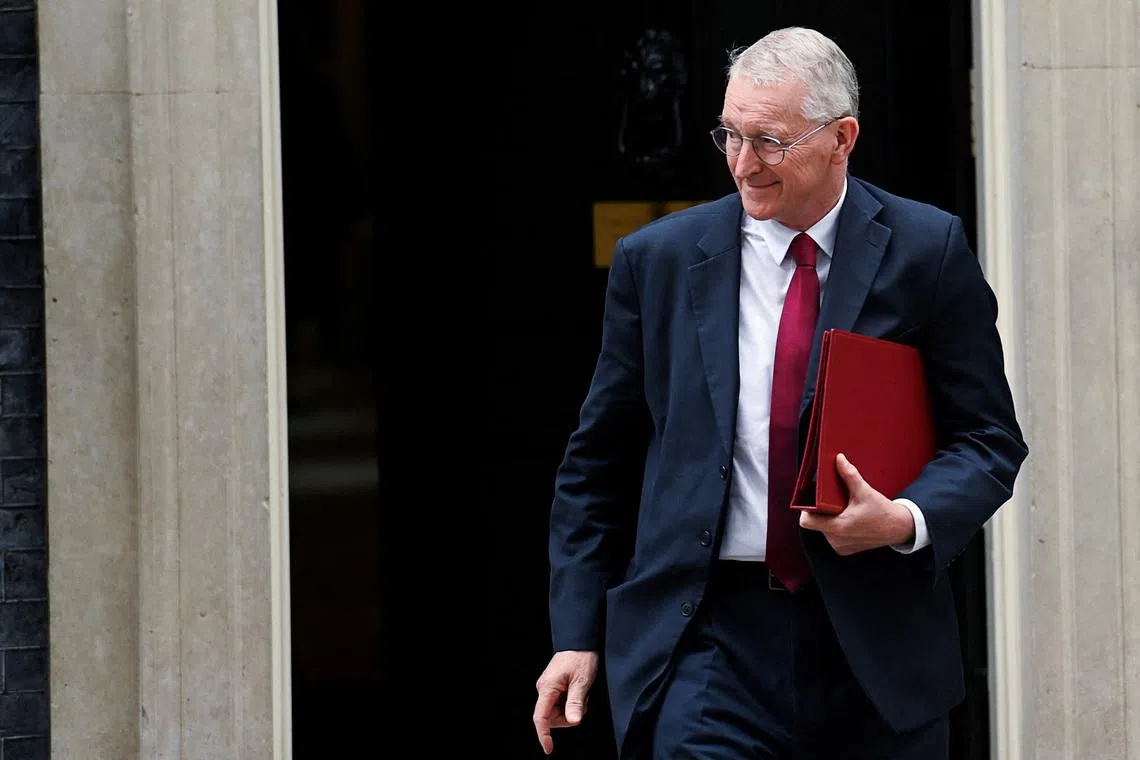 FILE PHOTO: Secretary of State for Northern Ireland Hilary Benn walks outside 10 Downing Street in London, Britain, September 3, 2024. REUTERS/Jaimi Joy/File Photo