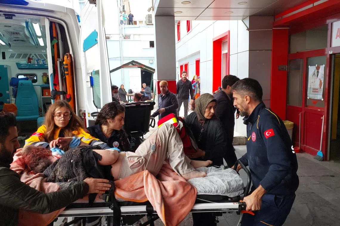 A woman injured in a rocket attack being taken to hospital in Karkarmis, Turkey, on Nov 21, 2022.