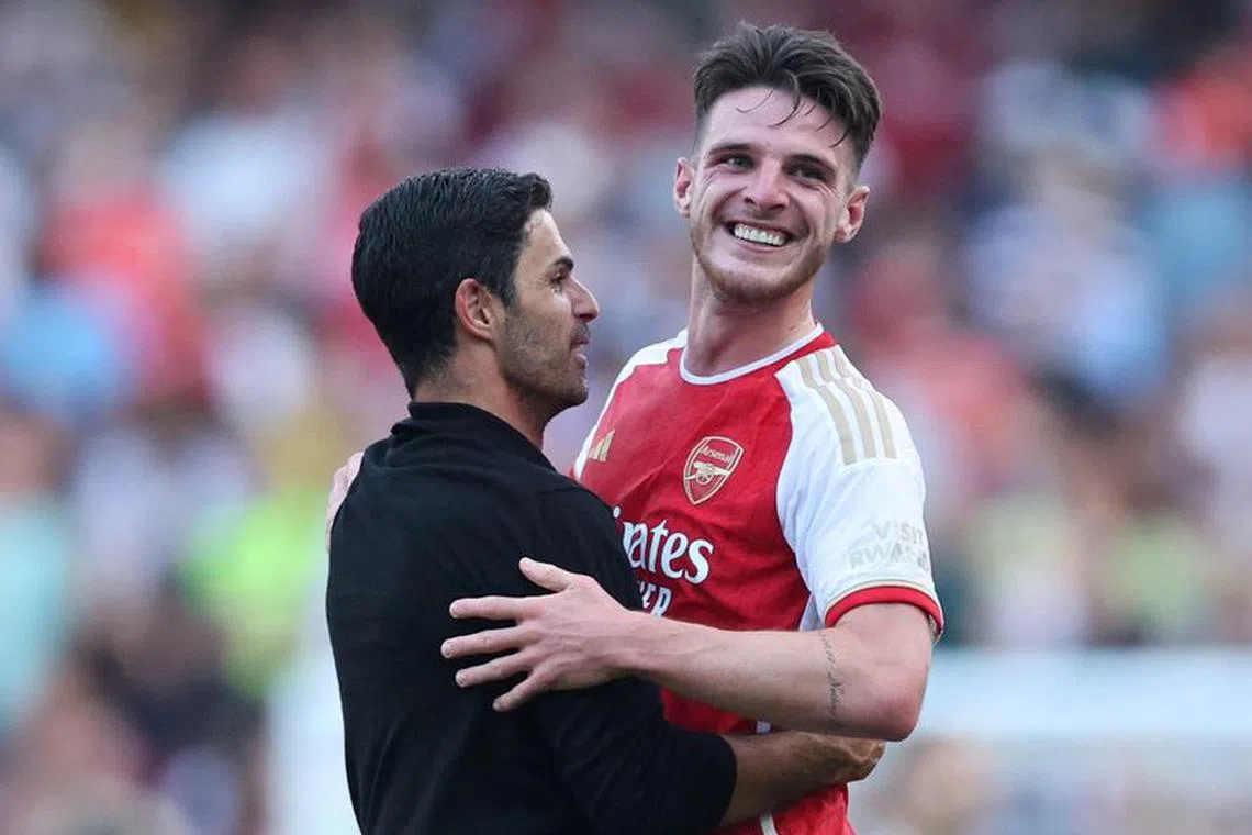 Soccer Football - Premier League - Arsenal v Manchester United - Emirates Stadium, London, Britain - September 3, 2023  Arsenal manager Mikel Arteta and Declan Rice celebrate after the match REUTERS/David Klein