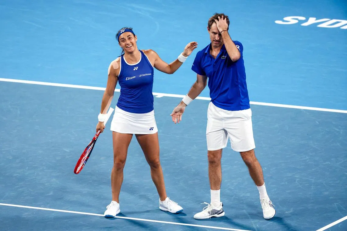 France's Caroline Garcia and Edouard Roger-Vasselin reacting after defeating Norway's Casper Ruud and Ulrikke Eikeri during their mixed doubles match at the United Cup.