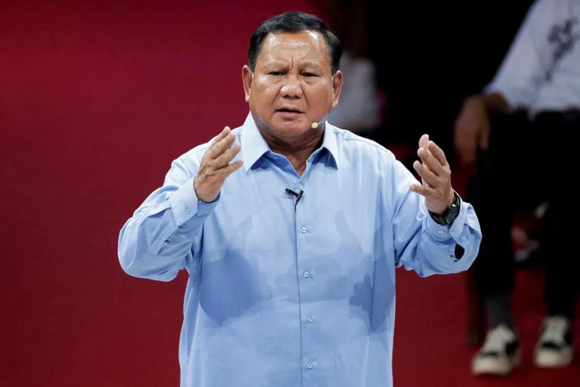 Indonesia's Defence Minister and presidential candidate, Prabowo Subianto, gestures during a televised debate at the election commission headquarters in Jakarta, Indonesia, December 12, 2023. REUTERS/Ajeng Dinar Ulfiana