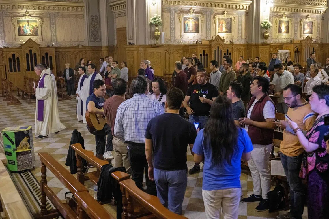 People attend mass at a Mexico City church which promotes the inclusion of the LGBTQ community into the Catholic church.