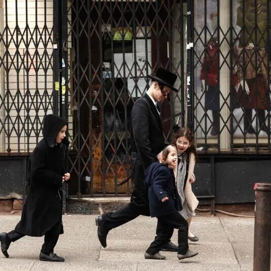 An Ultra-Orthodox Jewish family walking in the streets of Brooklyn, New York during Passover on April 2, 2026.