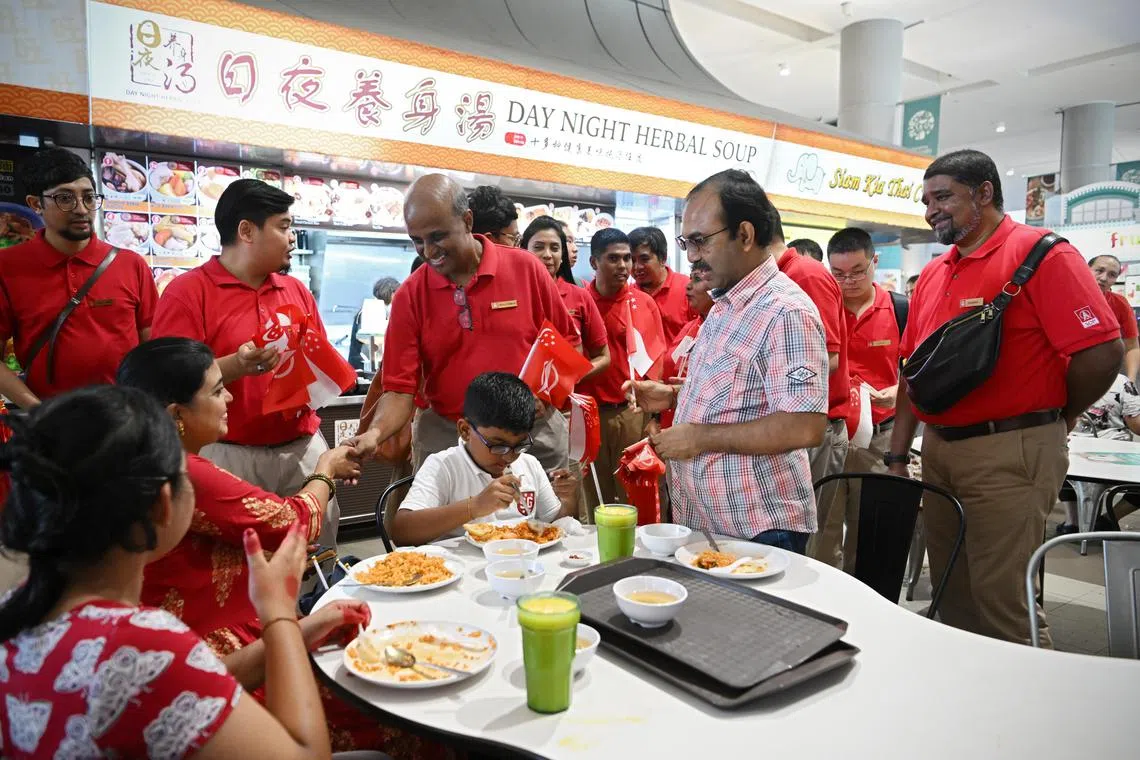 azsdp09/ST20230809_202338247538/Ng Sor Luan/The Singapore Democratic Party (SDP) led by party chairman Paul Tambyah at a walkabout at Kampung Admiralty Hawker Center on National Day. Sembawang GRC MP Mariam Jaafar from PAP is also on a walkabout at the center.