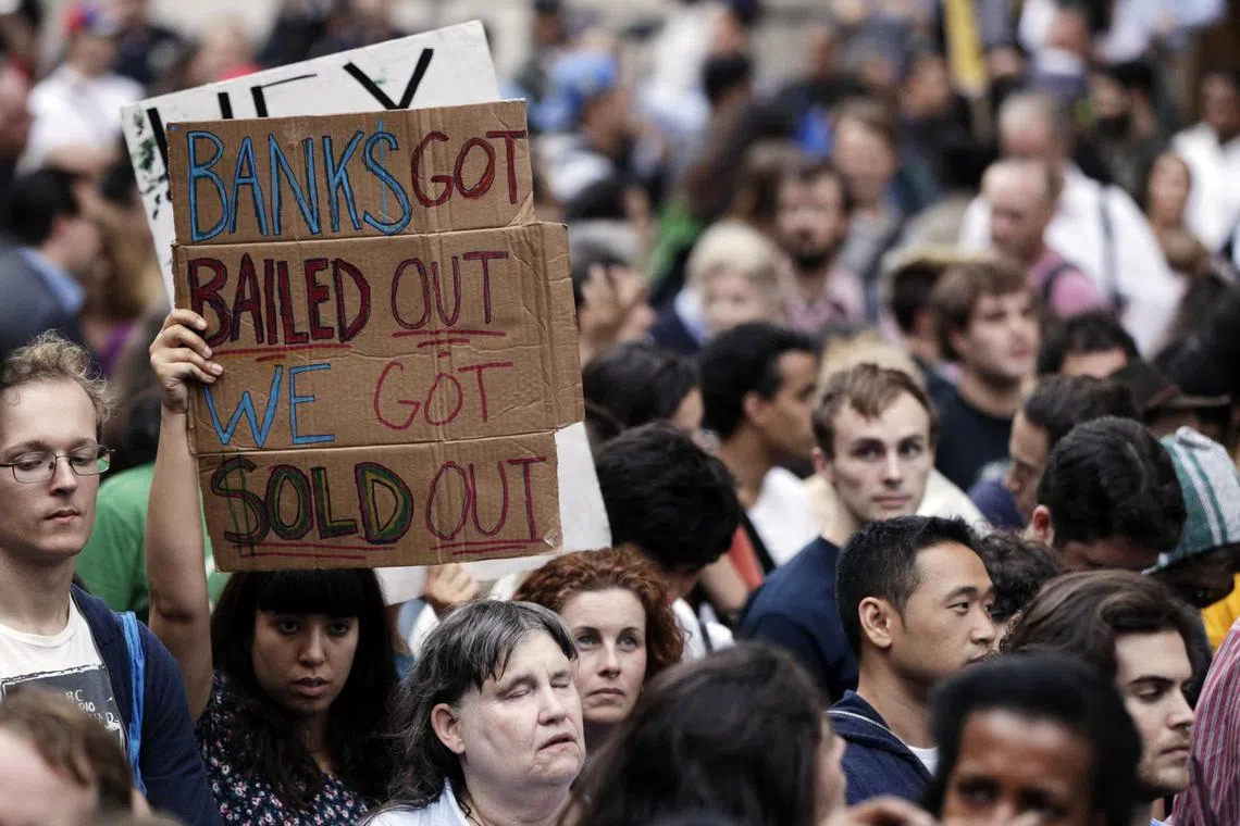 Demonstrators protesting in New York in 2011 over issues such as the 2008 bank bailouts – estimated to have cost taxpayers about US$700 billion.