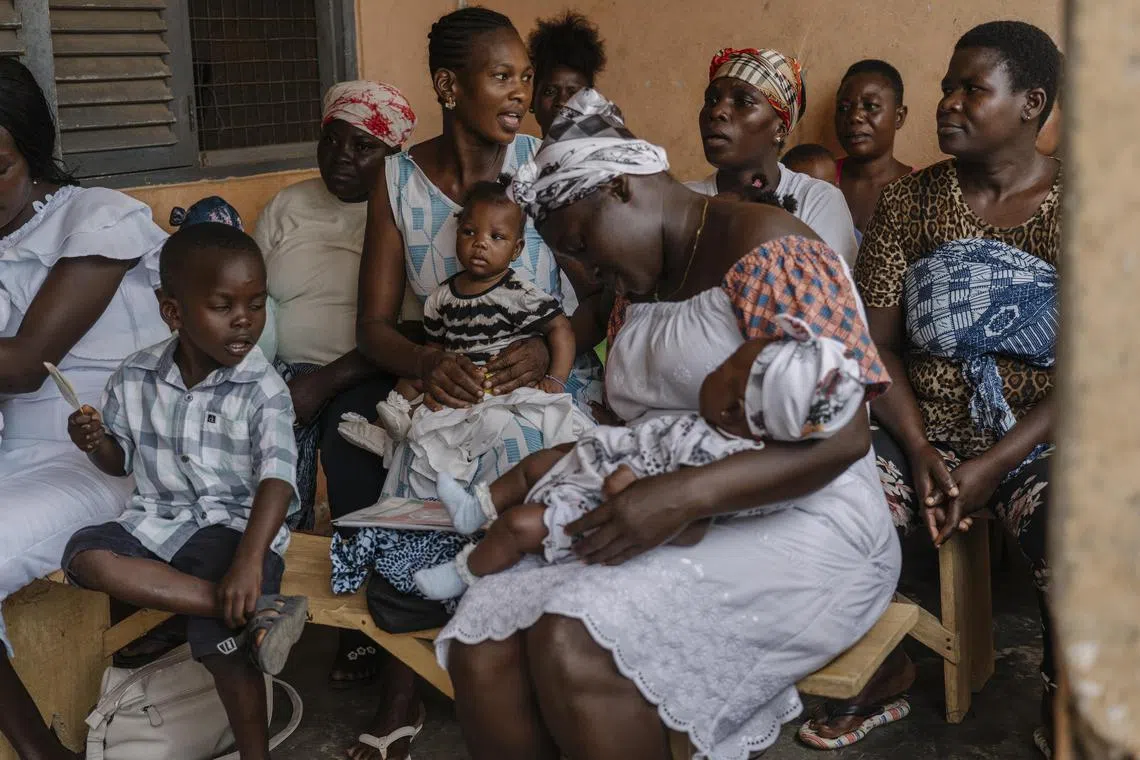 Mothers and babies waiting for shots in Accra, Ghana on July 19, 2023. 