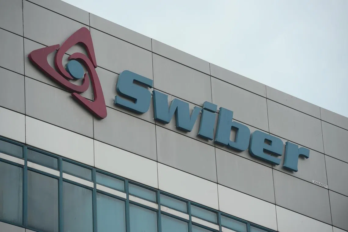 Swiber Holdings' logo on its building at 12 International Business Park. The oil and gas contractor has filed a winding-up application, and its directors have resigned to pursue their own interests.