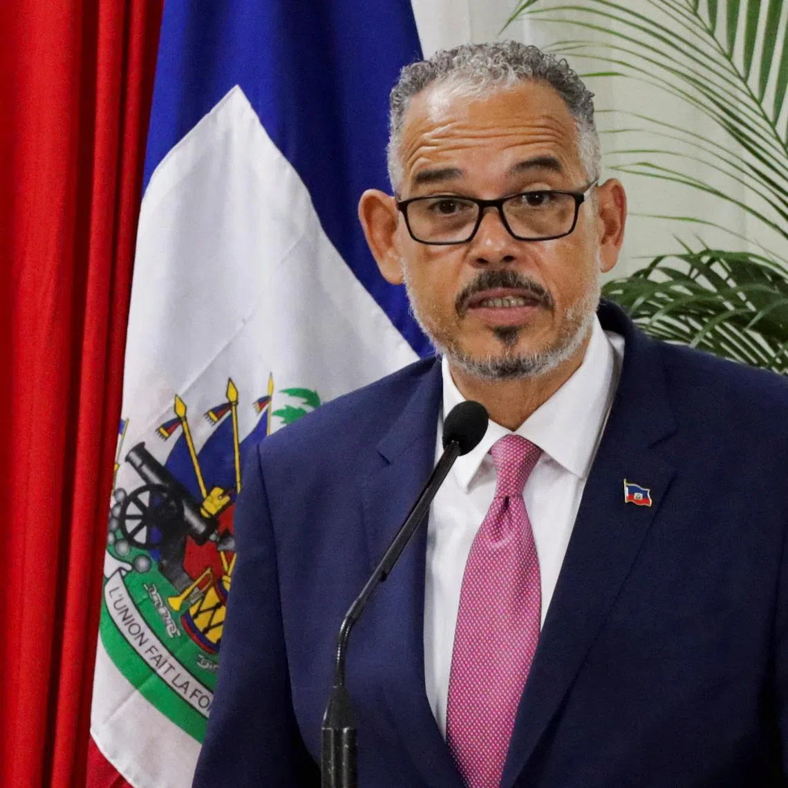 FILE PHOTO: Haiti's Prime Minister Alix Didier Fils Aime speaks during a ceremony on the day the mandate of the Caribbean nation's transitional governing council, a body intended to curb a bloody gang conflict and bring about long-delayed elections, ended with no succession plan in place, in Port-au-Prince, Haiti, February 7, 2026. REUTERS/Fildor Pq Egeder/File Photo