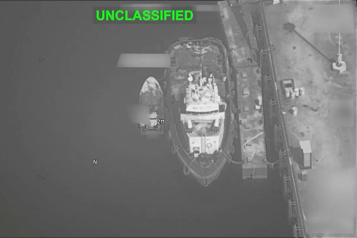 A boat is targetted, at an unknown location, during what the US Central Command says are strikes on Iranian military targets, in this screengrab taken from a handout video released on July 23.
