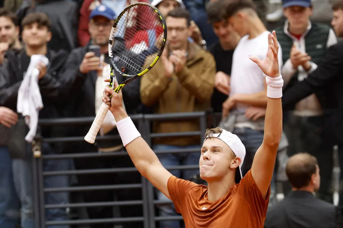 Holger Rune of Denmark celebrates winning against Casper Ruud of Norway during his men's singles semi-finals match.