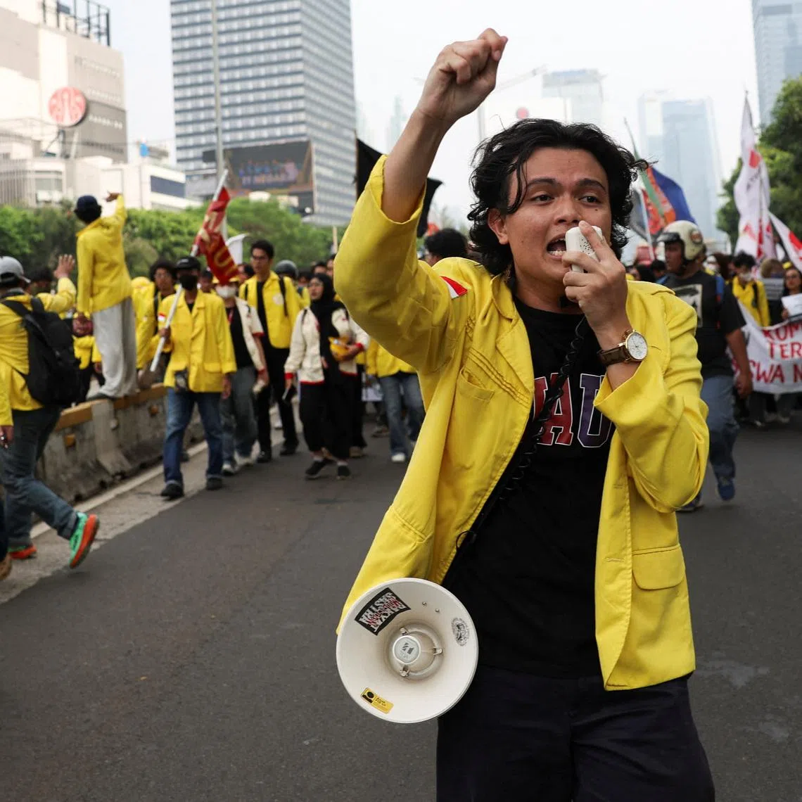 A student uses a megaphone to shout slogans during a protest against government policies, including state budget spending, a fuel price hike, a free meals programme, and expanded military roles in civilian affairs, in Jakarta, Indonesia, June 12, 2026. REUTERS/Ajeng Dinar Ulfiana