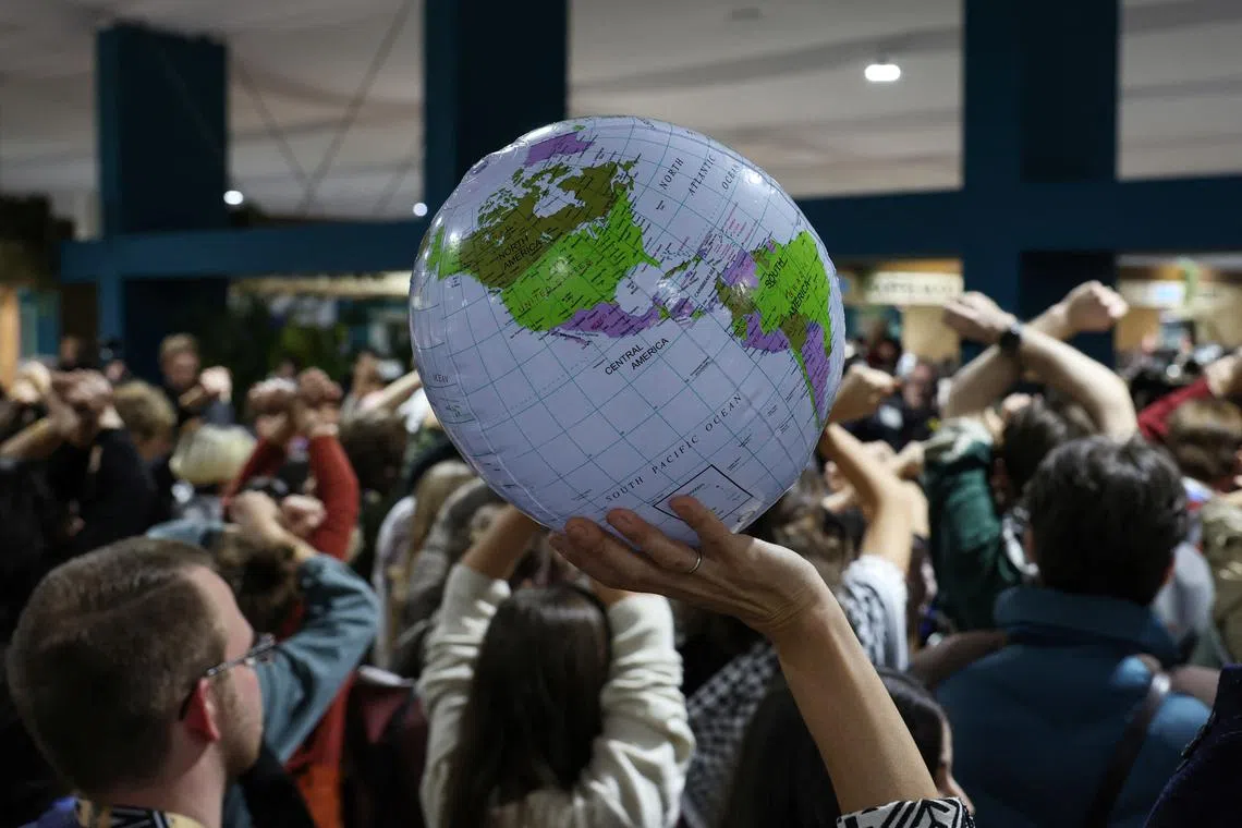 Activists hold a silent protest against the draft agreement, during the COP29 United Nations Climate Change Conference, in Baku, Azerbaijan November 22, 2024. REUTERS/Murad Sezer