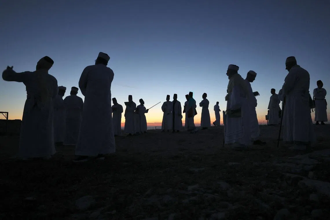 Samaritan worshippers gathering at dawn on May 10 to pray on top of Mount Gerizim near the northern West Bank city of Nablus, during celebrations of Passover according to their tradition. Samaritans are a community of a few hundred people living in Israel and in the Nablus area, who trace their lineage to the biblical ancient Israelites. 
