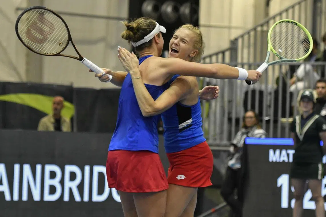 Katerina Siniakova (right) and Barbora Krejcikova of the Czech Republic celebrate after defeating Taylor Townsend and Danielle Collins of United States in their doubles match in the Billie Jean King Cup.