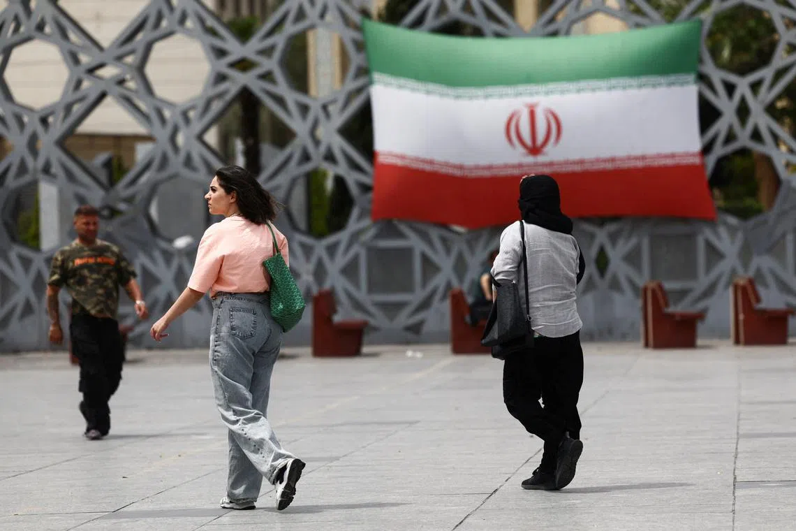 Iranian women walk on a street, amid a ceasefire between U.S. and Iran, in Tehran, Iran, April 27, 2026. Majid Asgaripour/WANA (West Asia News Agency) via REUTERS/File Photo