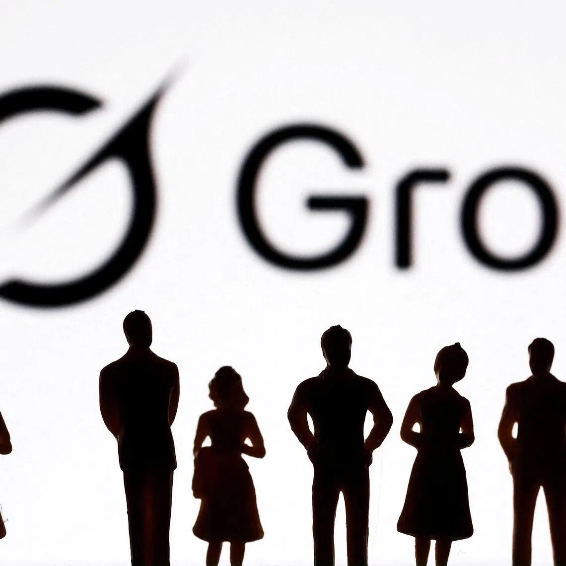 Miniature figurines and Grok logo are seen in this illustration taken July 20, 2026. REUTERS/Dado Ruvic/Illustration
