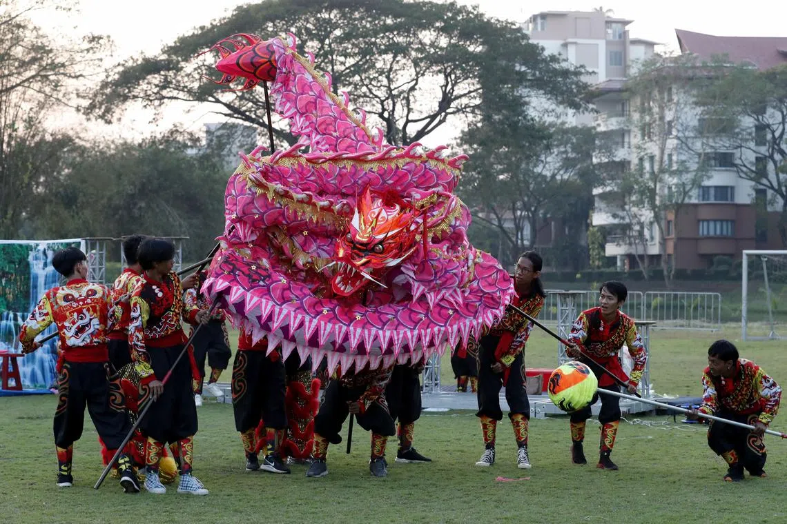Dragon dancers from the Moe Nagar Lion and Dragon performance group performing at the Pun Hlaing's Chinese New Year Evening Bazaar in Yangon, Myanmar on Feb 9 2024. 