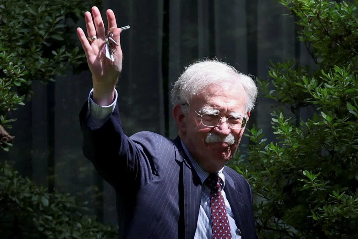 FILE PHOTO: Former White House national security adviser John Bolton arrives at his house following its search by the FBI in Bethesda, Maryland, U.S., August 22, 2025. REUTERS/Tasos Katopodis/File Photo