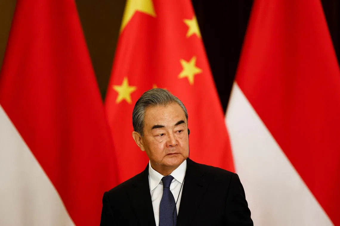 Chinese Foreign Minister Wang Yi listens during a joint press conference with Indonesian Foreign Minister Retno Marsudi (not pictured) following their bilateral meeting in Jakarta, Indonesia, April 18, 2024. REUTERS/Willy Kurniawan/ File Photo