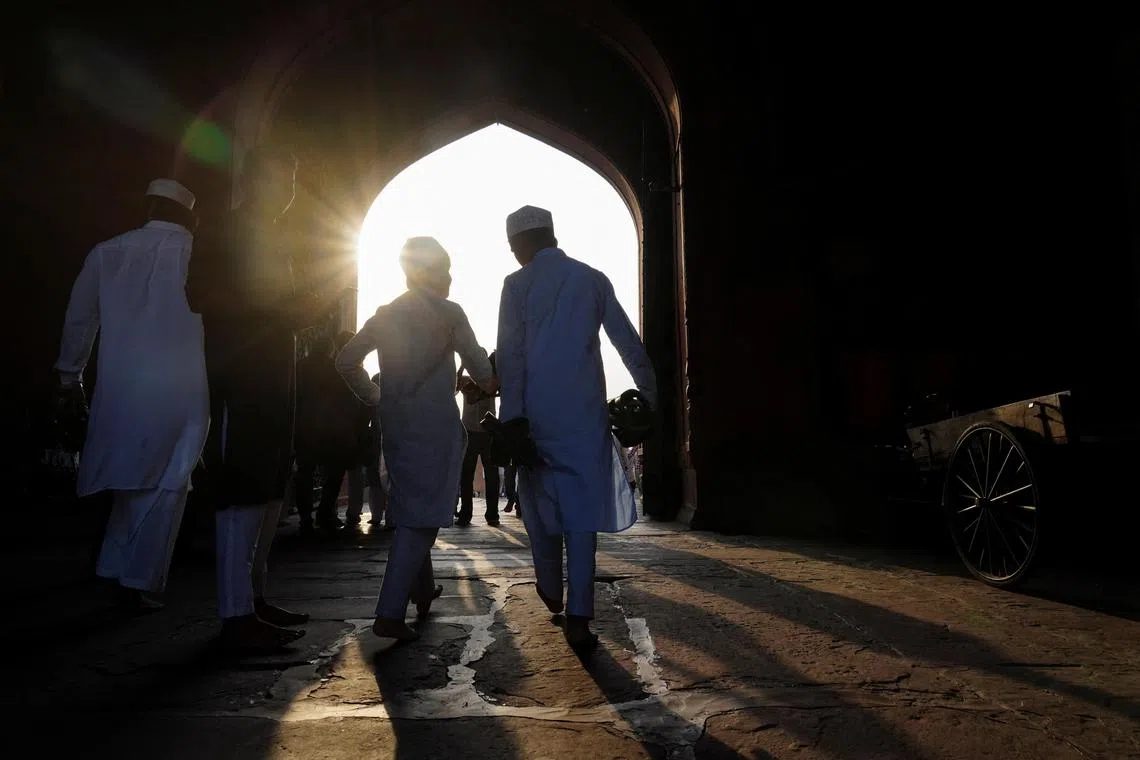 Muslims leave after offering prayers at the Jama Masjid on the occasion of Eid al-Adha, in the old quarters of Delhi, India, on June 7, 2025.