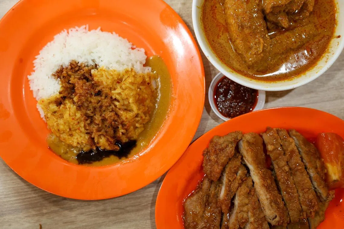 Signature offerings from Loo’s Hainanese Curry Rice include (clockwise from left) rice with its curry sauce, chicken curry and pork chop.