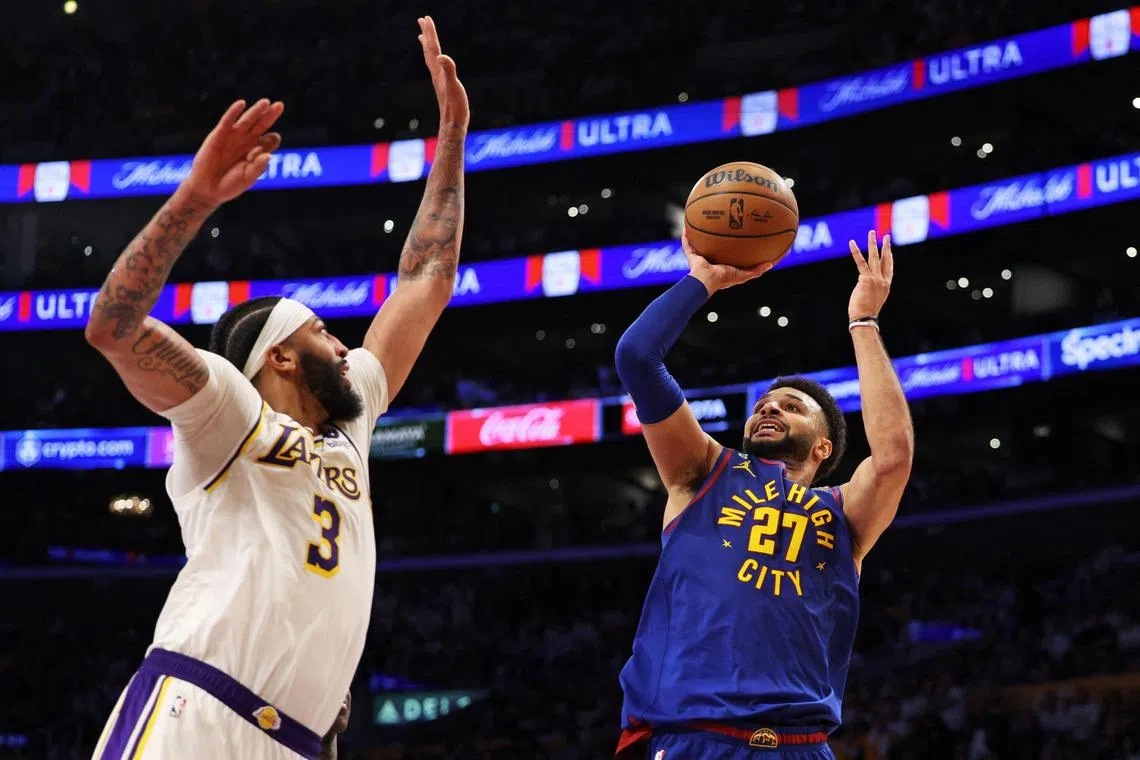 Jamal Murray of the Denver Nuggets shoots the ball against Anthony Davis of the Los Angeles Lakers during Game 3 of the NBA Western Conference Finals.