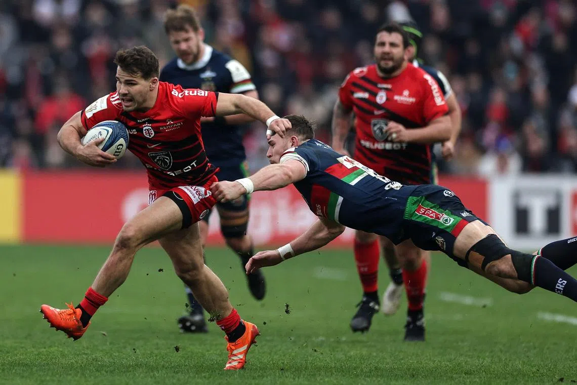 Toulouse's French scrum-half Antoine Dupont being tackled by Leicester's English fullback Freddie Steward during the European Rugby Champions Cup match between Toulouse and Leicester Tigers at the Ernest-Wallon stadium in Toulouse, south-western France, on Jan 19.