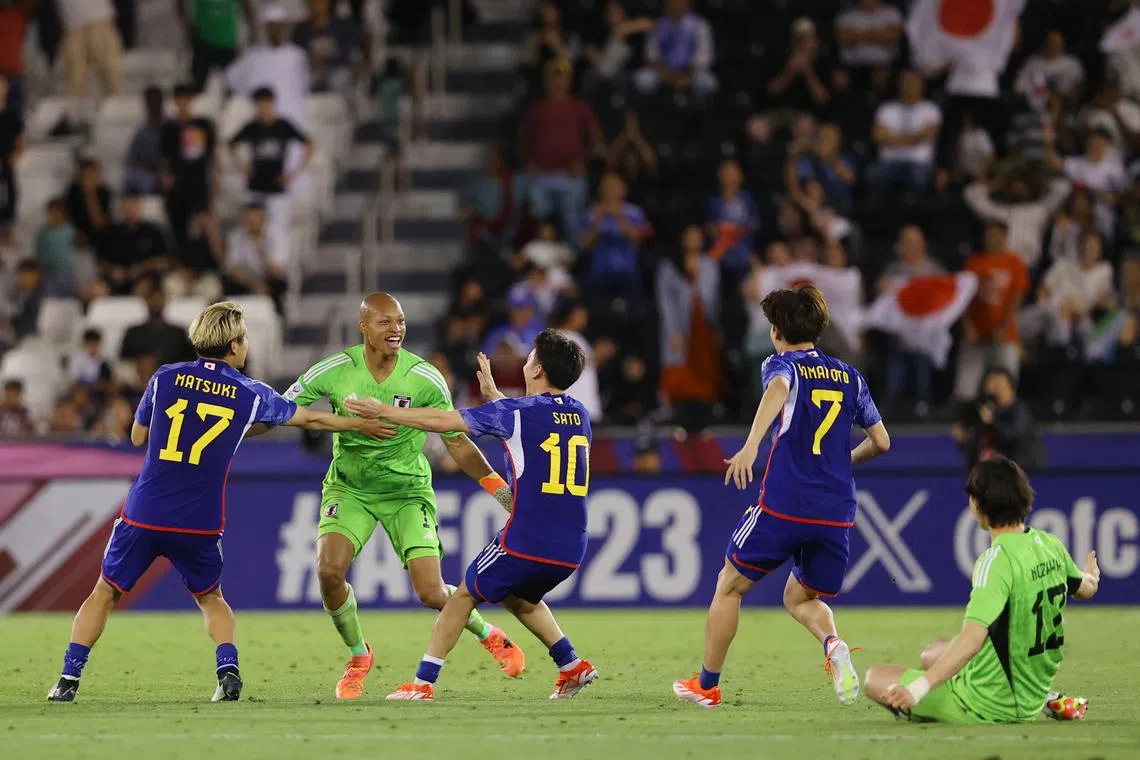 Soccer Football - AFC U-23 Asian Cup - Final - Japan v Uzbekistan - Jassim Bin Hamad Stadium, Doha, Qatar - May 3, 2024 Japan's Kuryu Matsuki, Leo Kokubo and Kein Sato celebrate after the match REUTERS/Ibraheem Al Omari