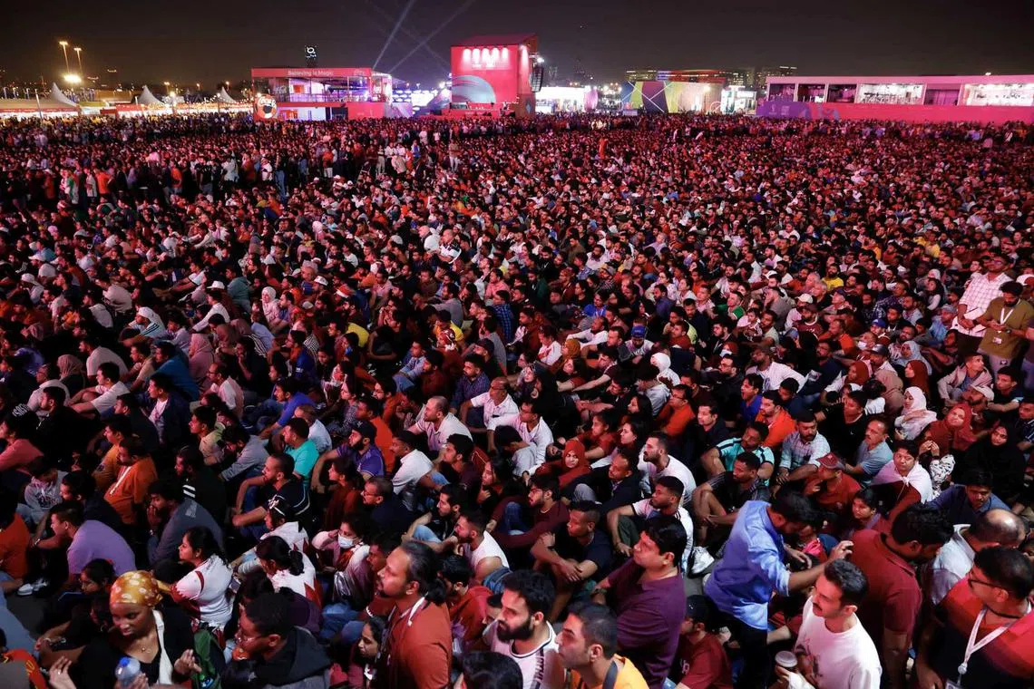 Fans watching the opening match between Qatar and Equador on the screen at the FIFA World Cup 2022 Fan Festival in Doha, Qatar, 20 Nov 2022. 