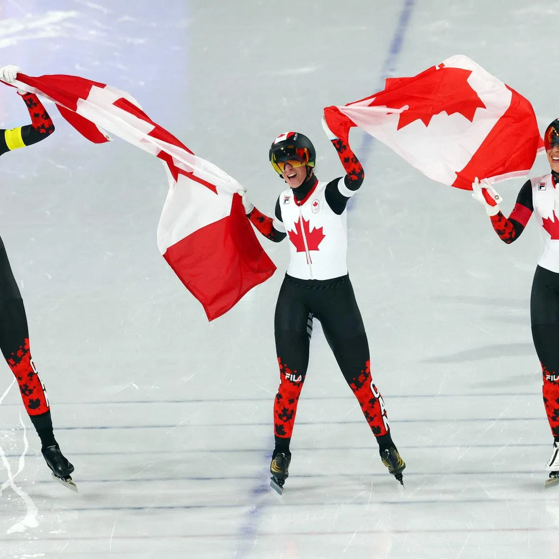 Milano Cortina 2026 Olympics - Speed Skating - Women's Team Pursuit Final A - Netherlands vs Canada - Milano Speed Skating Stadium, Milan, Italy - February 17, 2026. Isabelle Weidemann of Canada, Valerie Maltais of Canada and Ivanie Blondin of Canada celebrate winning gold the Women's Team Pursuit Final A against Netherlands REUTERS/Yves Herman