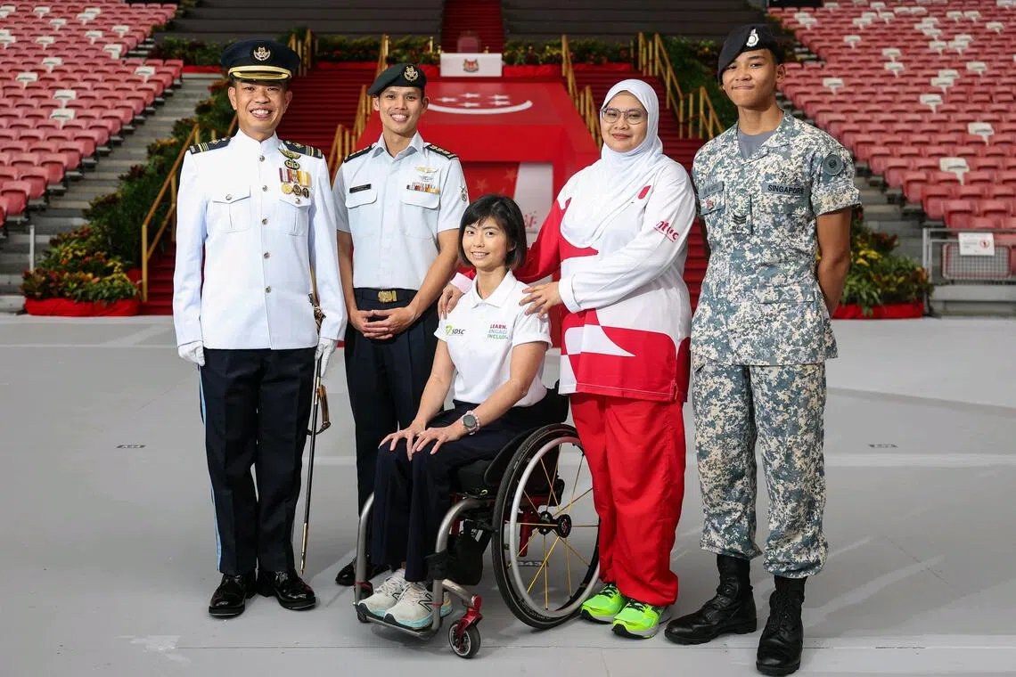 (From left) NDP parade commander, Military Expert 6 Caleb Chia, NDP parade and ceremony committee chairman Colonel Anthony Lau, the Singapore Disability Sports Council’s contingent commander Yap Qian Yin, NTUC contingent member Siti Radziah Zainal Abidin, and her son Ari Wafiy Muhammad Mahfudz, who will join the National Cadet Corps (Sea) contingent.