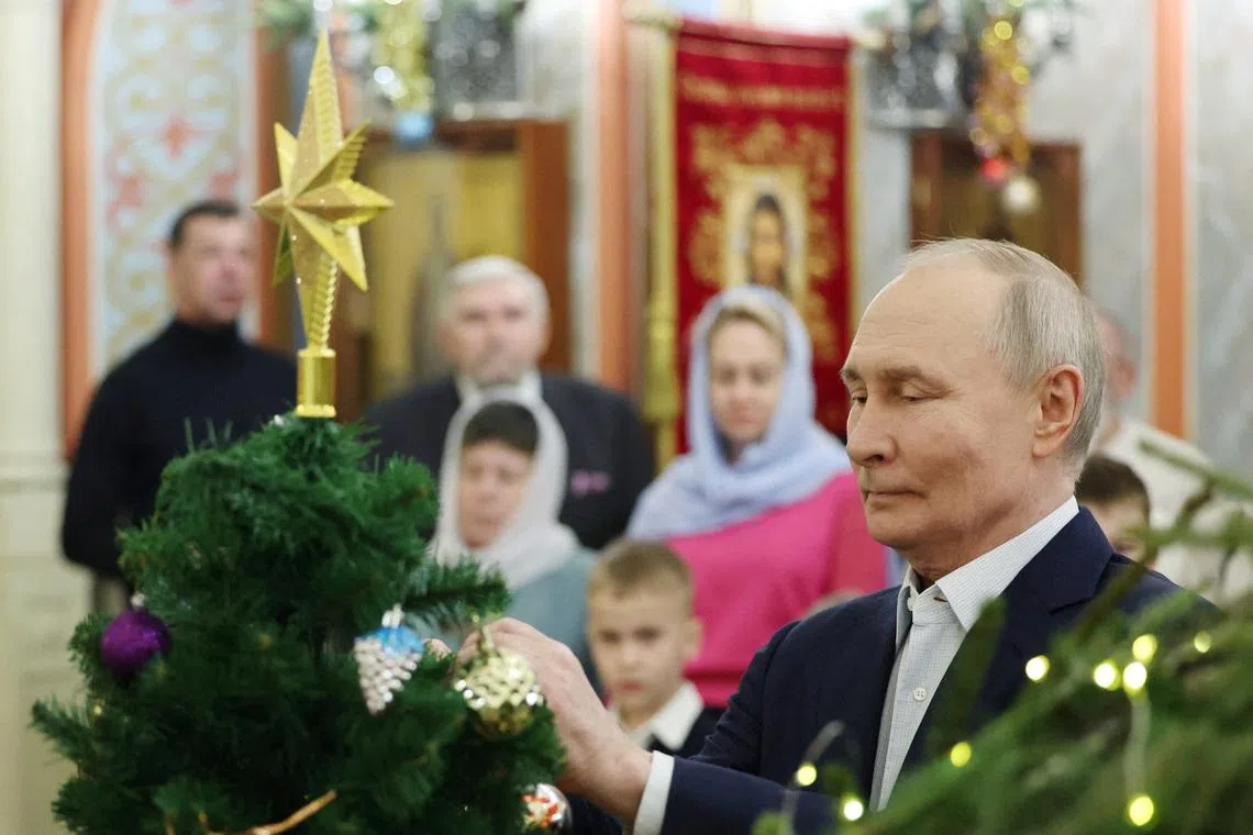 Russia's President Vladimir Putin attends the Orthodox Christmas liturgy at a church in the Moscow region, Russia, January 7, 2026. Sputnik/Vyacheslav Prokofyev/Pool via REUTERS