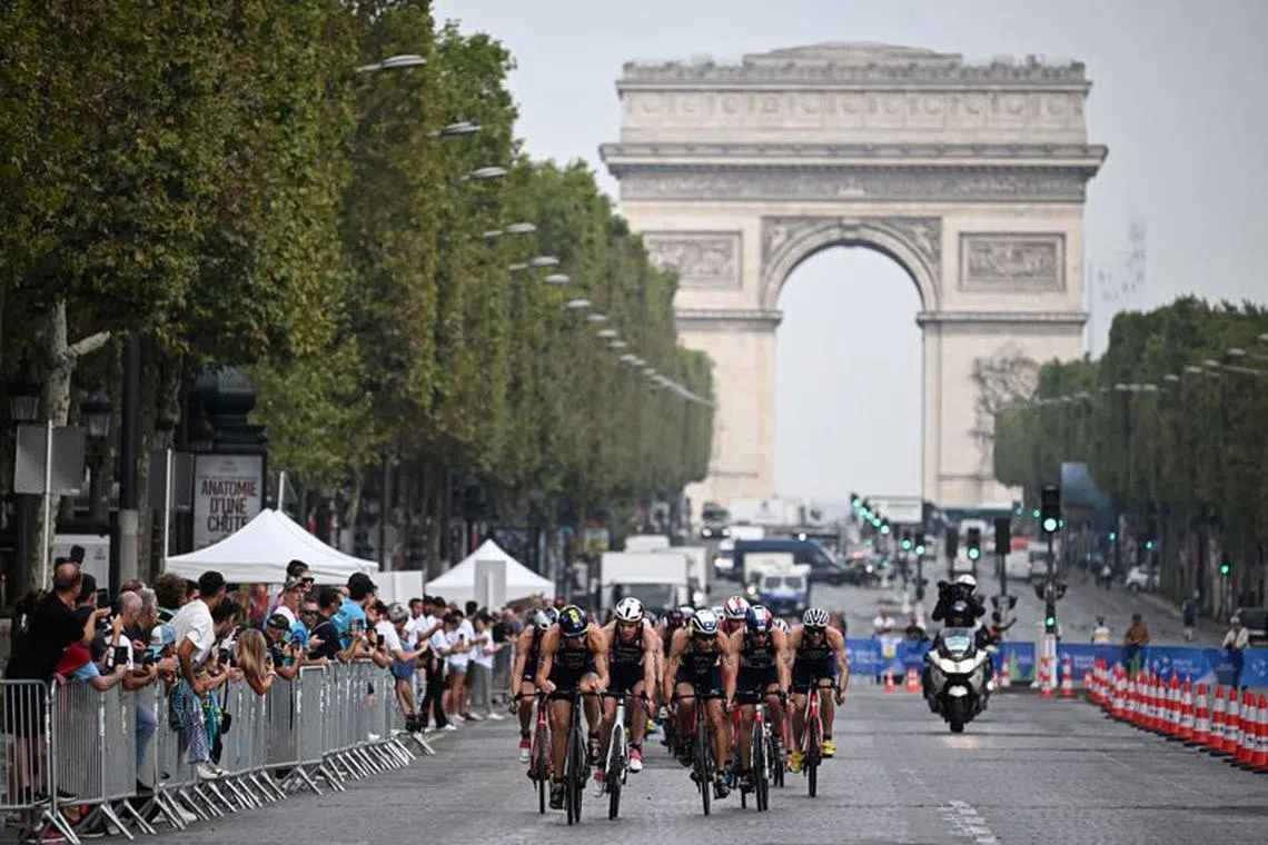 Olympics - Paris 2024 holds triathlon test event for the Olympics - Paris, France - August 18, 2023  The Arc de Triomphe is seen as athletes compete in the elite men triathlon test event   Emmanuel Dunand/Pool via REUTERS/File photo