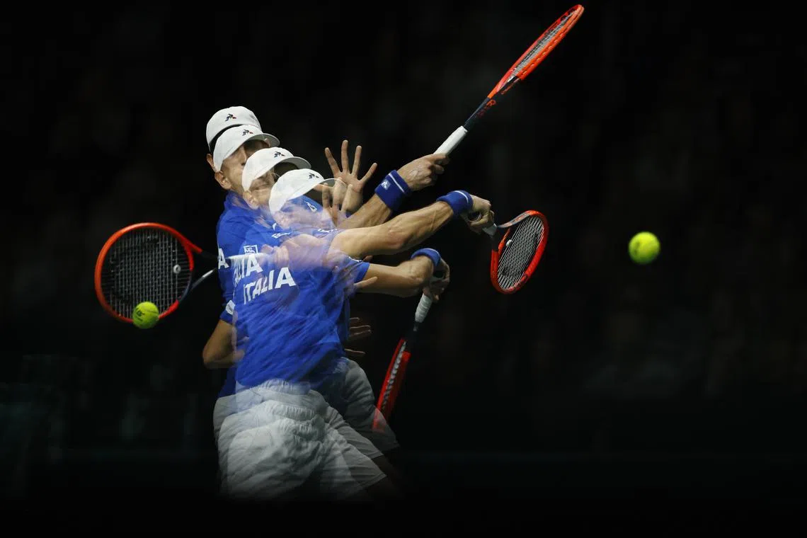 A multiple exposure photograph of the Italian Matteo Arnaldi in action against the Australian Alexei Popyrin during their singles match of the 2023 Davis Cup Final 8 finals Italy vs Australia in Malaga, Spain on  Nov 26, 2023.  