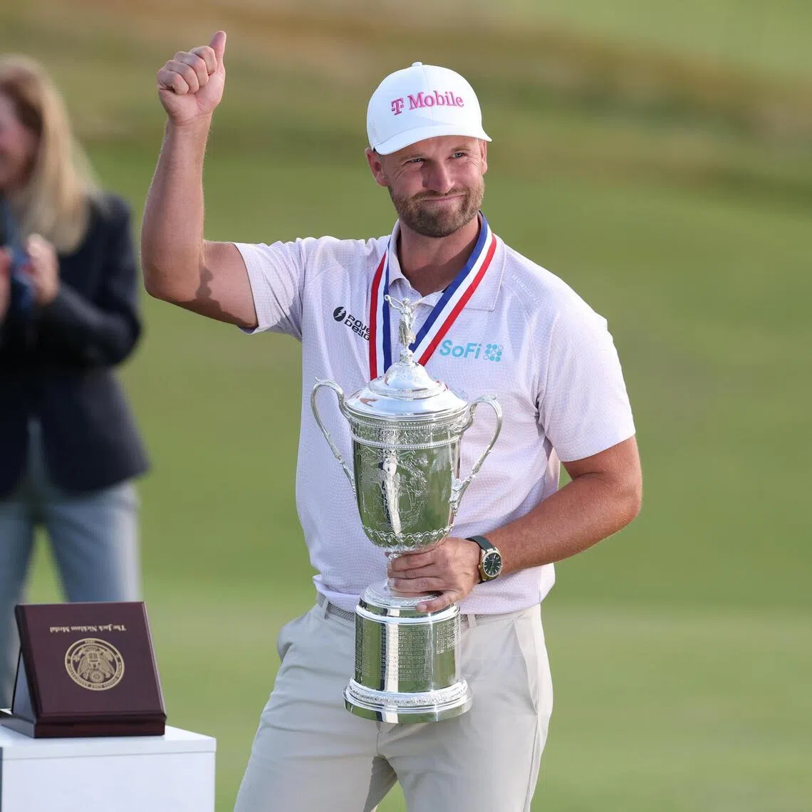 Wyndham Clark celebrating with the trophy after winning the US Open golf tournament at the Shinnecock Hills Golf Club in Southampton, New York, on June 21.