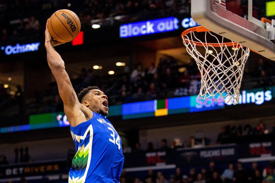 Milwaukee Bucks forward Giannis Antetokounmpo dunking the ball against New Orleans Pelicans guard Dyson Daniels during the second half at Smoothie King Centre. He tallied 42 points and 10 rebounds in the Bucks' 128-119 win.