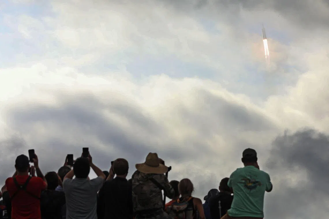 A SpaceX Falcon Heavy rocket carrying the Psyche spacecraft launches from Nasa's Kennedy Space Centre.