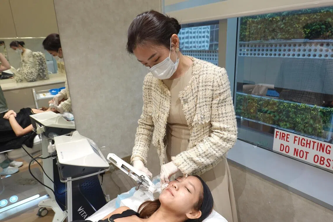 Rachel Ho performing Rejuran skin booster treatment on a patient.
