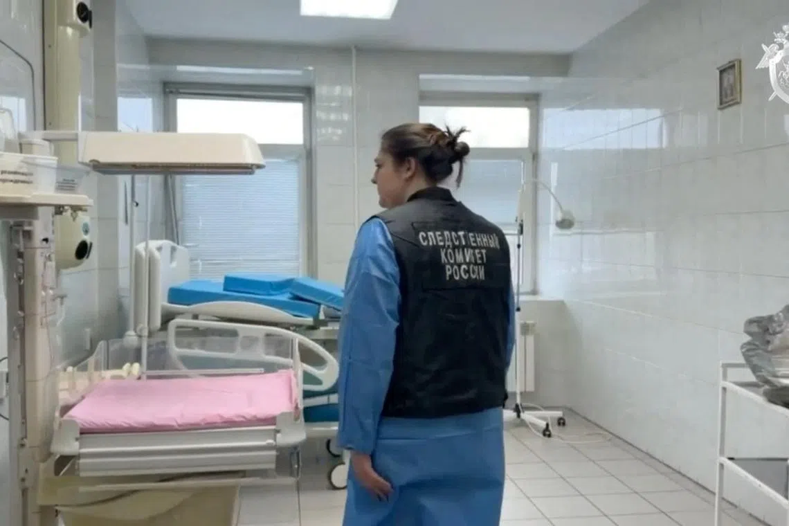 An investigator inspecting a delivery room at a maternity hospital in Novokuzhetsk, Russia, where nine newborn babies died in January.