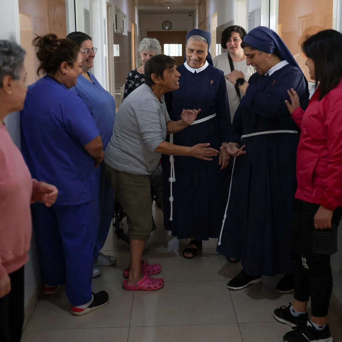 General superior of the congregation of the franciscan sisters of the cross, Mother Marie Makhlouf and Director of De La Croix Psychiatric Hospital, sister Rose Hanna, talk with patients at the hospital in Jal el-Dib, Lebanon November 19, 2025. REUTERS/Mohamed Azakir