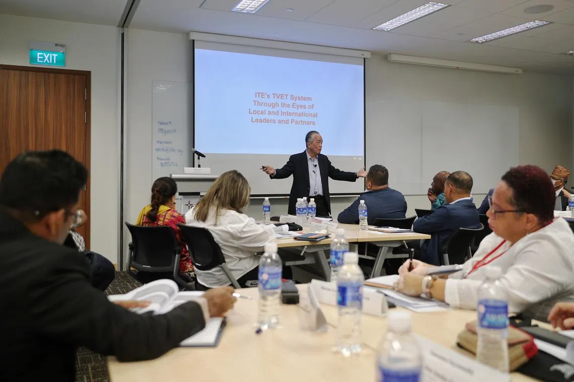 ST20220927_202202951620/hbscp/Hariz/Jason Quah
Singapore Cooperation Programme participants listen as Tan Seng Hua, senior consultant, ITE educational services, delivers a training course on TVET at ITE headquarters on Sept 27, 2022.
// Insight feature on the 30th anniversary of the Singapore Cooperation Programme.