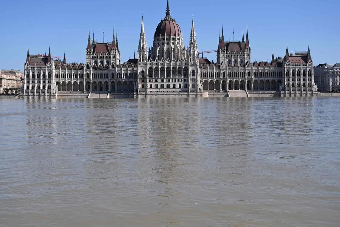 TOPSHOT - The Parliament building in Budapest is pictured as the flood water reached its base and stairs in Budapest, Hungary, on September 21, 2024, as the river Danube reached its peak at 830 cm in the Hungarian capital. The Danube reached its peak on September 21, 2024 in a heavily fortified Budapest with the water reaching the steps of parliament, marking a 10-year high, after deadly storm Boris lashed Europe.
Torrential rains and strong winds have led to widespread flooding in central and eastern Europe since last week, killing 24 people and devastating towns and villages. (Photo by Attila KISBENEDEK / AFP)