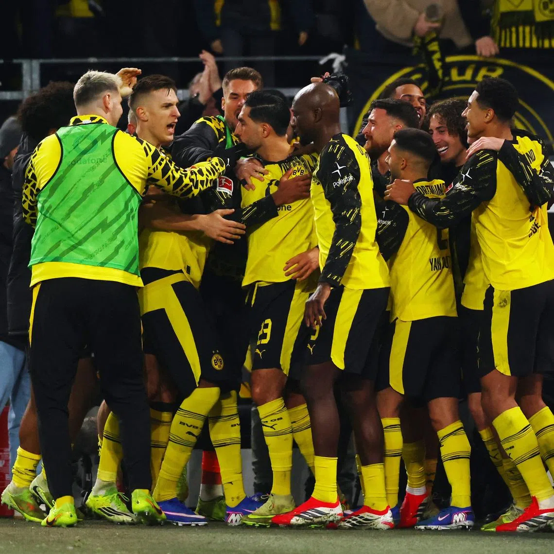 Soccer Football - Bundesliga - Borussia Dortmund v St. Pauli - Signal Iduna Park, Dortmund, Germany - January 17, 2026 Borussia Dortmund's Emre Can Jones celebrates scoring their third goal with teammates REUTERS/Thilo Schmuelgen