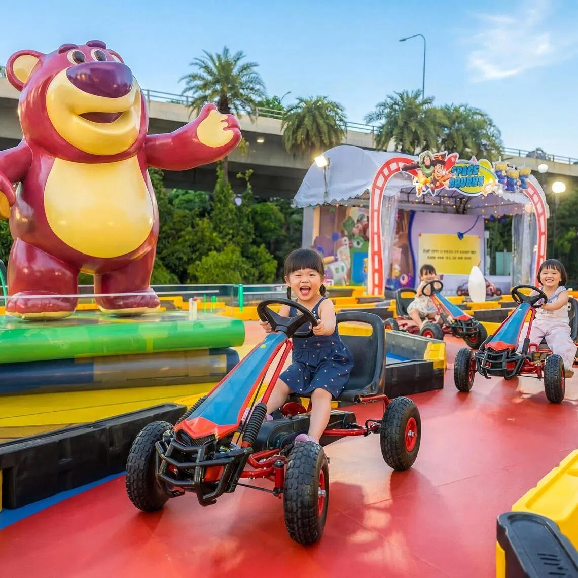 Kids can pedal in a circuit surrounded by Toy Story characters including Lots-o'-Huggin' Bear.