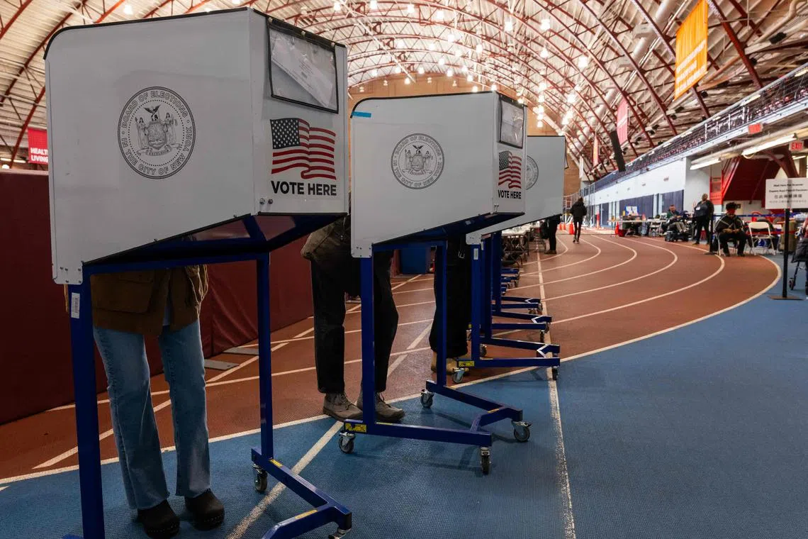 New Yorkers participate in early voting at a polling site in Brooklyn on Oct 29. US voters do not directly elect the president and vice-president. 
