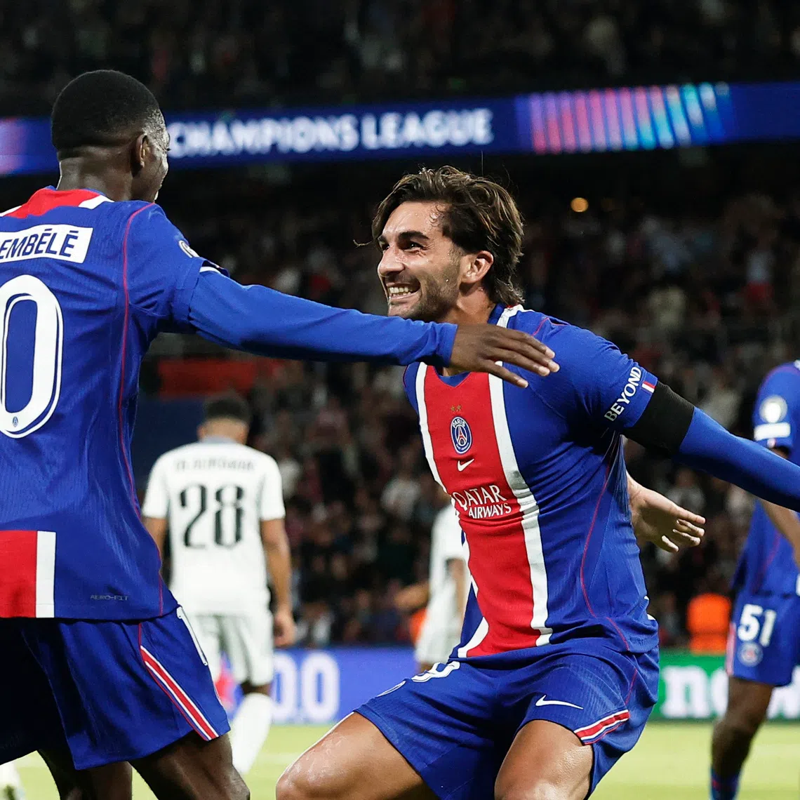 Soccer Football - UEFA Champions League - Paris St Germain v Slovan Bratislava - Parc des Princes, Paris, France - September 9, 2026 Paris St Germain's Ferran Torres celebrates scoring their fifth goal with Ousmane Dembele REUTERS/Benoit Tessier