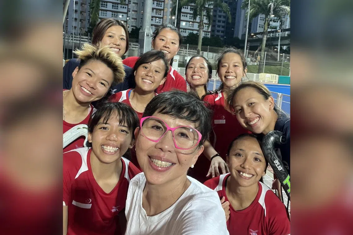 Singapore Sports Institute athlete life mentor Dolly Lo supporting the Singapore women's hockey team at the 4 Nations tournament in Dec 2023.