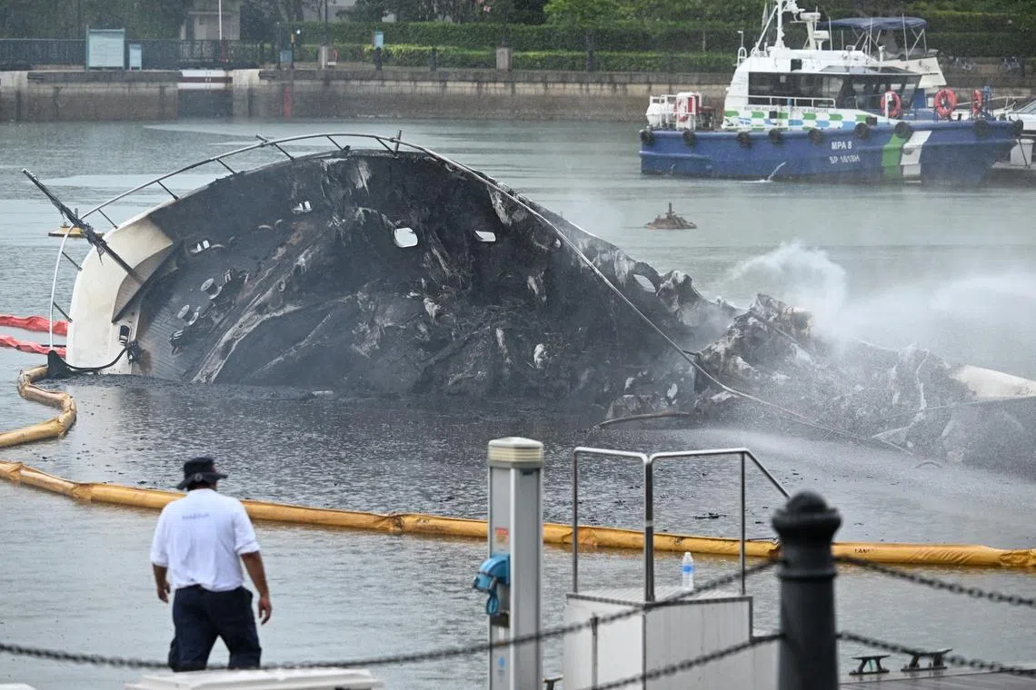 The remains of a luxury yacht which caught fire in Sentosa Cove, on the morning of June 7, 2026. 
The Singapore Civil Defence Force (SCDF) said it was alerted to the fire at around 8.10am, and used two water jets from a pontoon to battle the blaze, with a marine vessel activated for support. 
